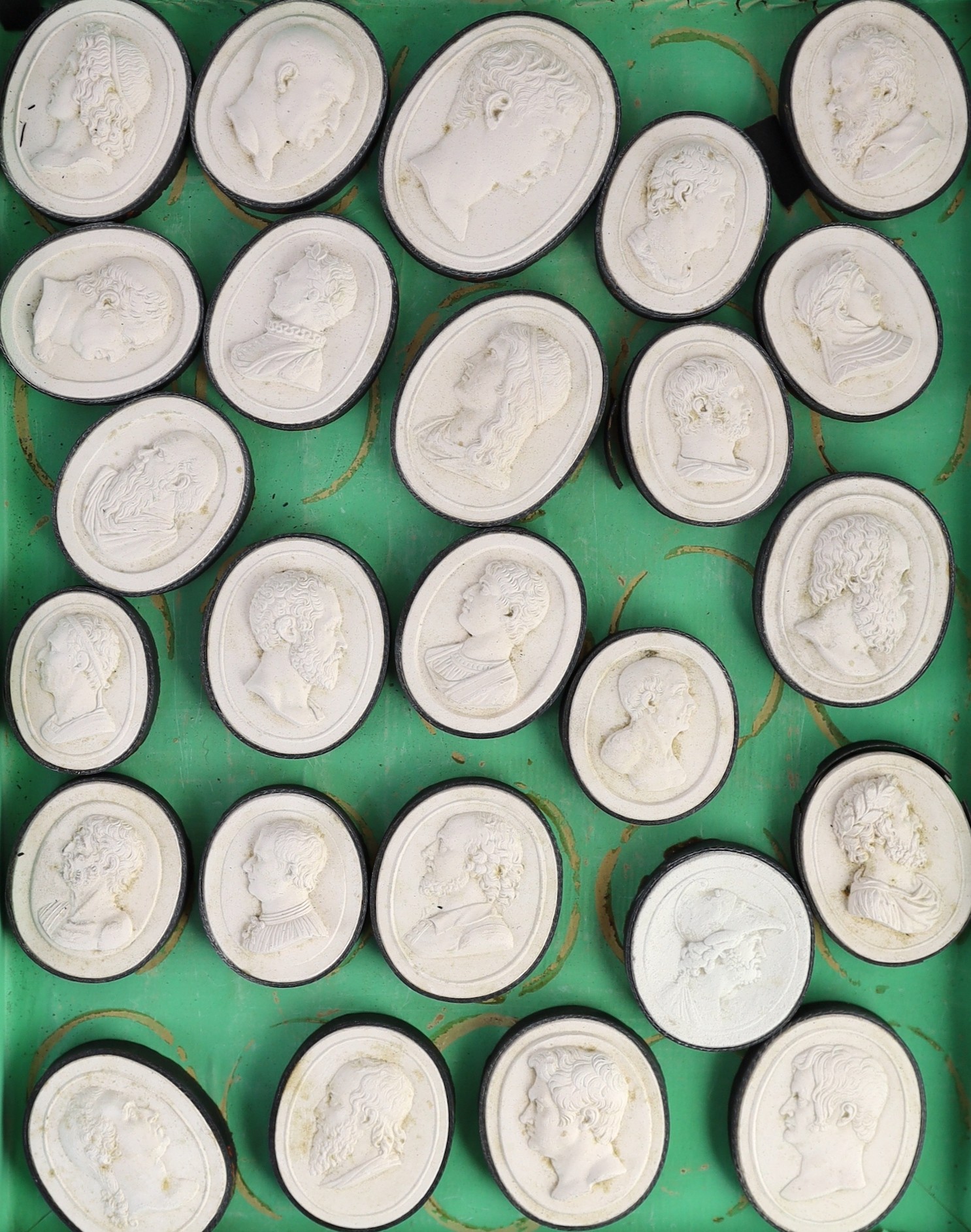 A cased set of eighty three Italian Grand Tour plaster roundels after intaglios of various subjects, box 29 x 22.5cm, largest cameo 5 x 4cm